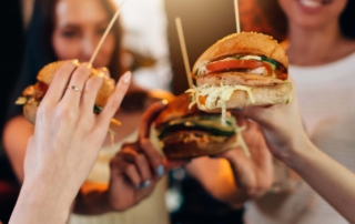 A group of women enjoying Best Burger In Oregon.